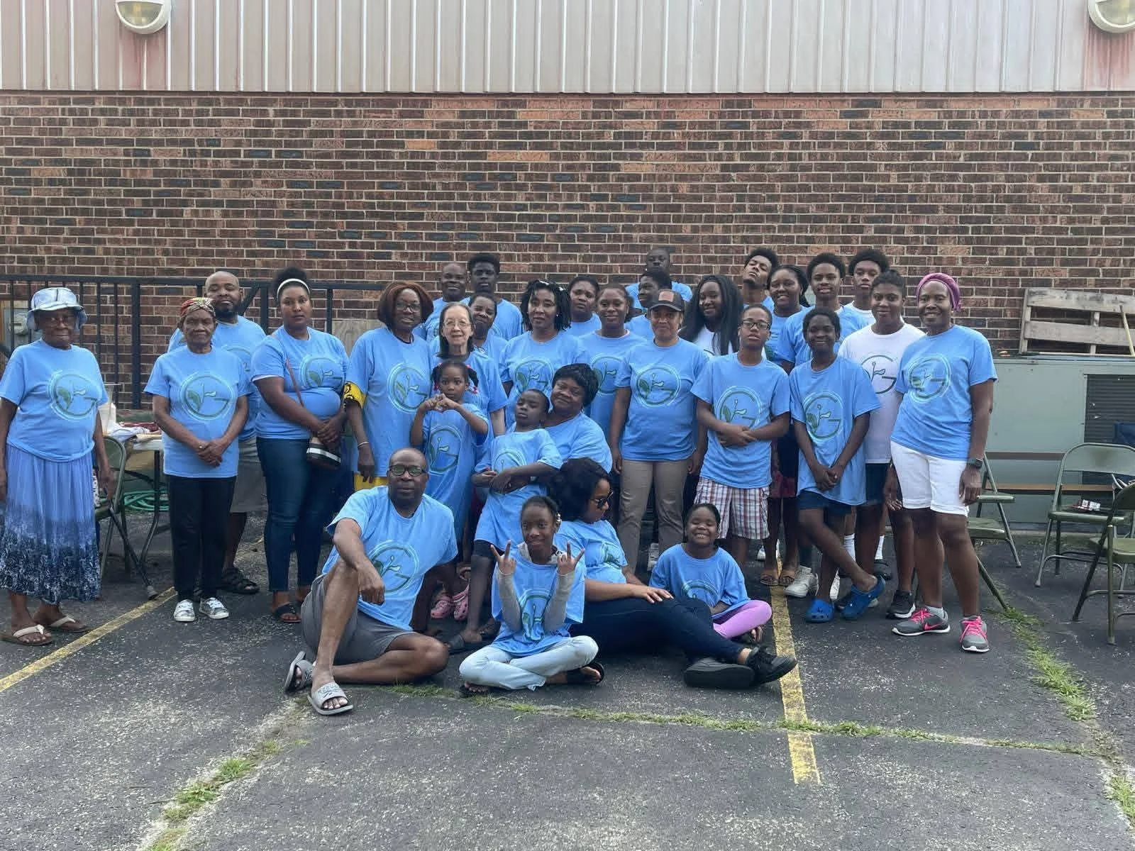 The Bethel church family gathered outside in matching blue shirts